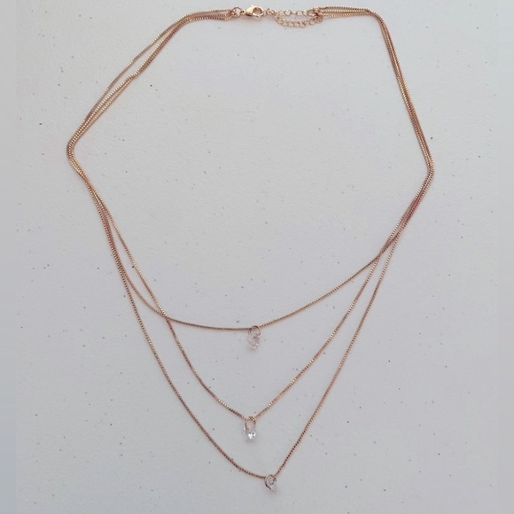 GOLDEN 3 LAYERED STAGGERED CHAIN NECKLACE WITH CLEAR JEWELED HEARTS - Picture 1 of 3